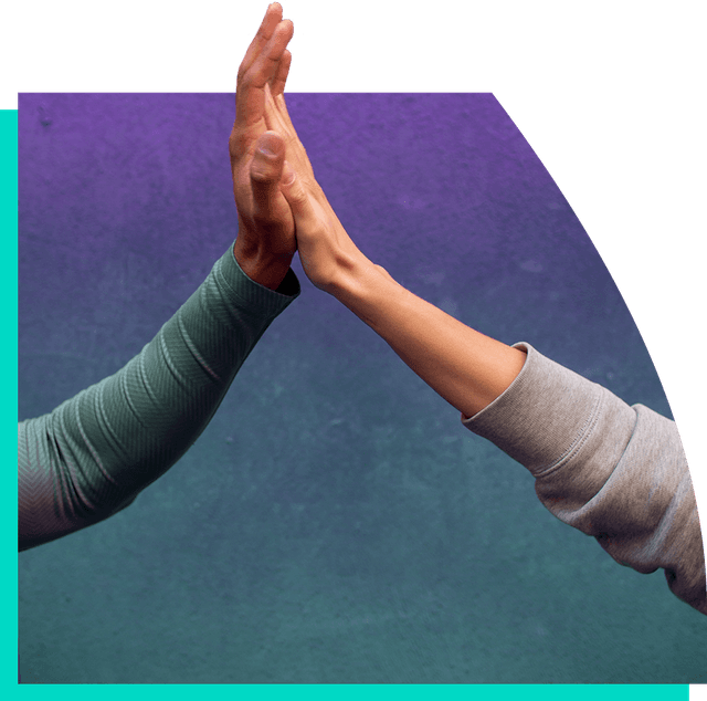 Two hands coming together in a high five between a man and a woman